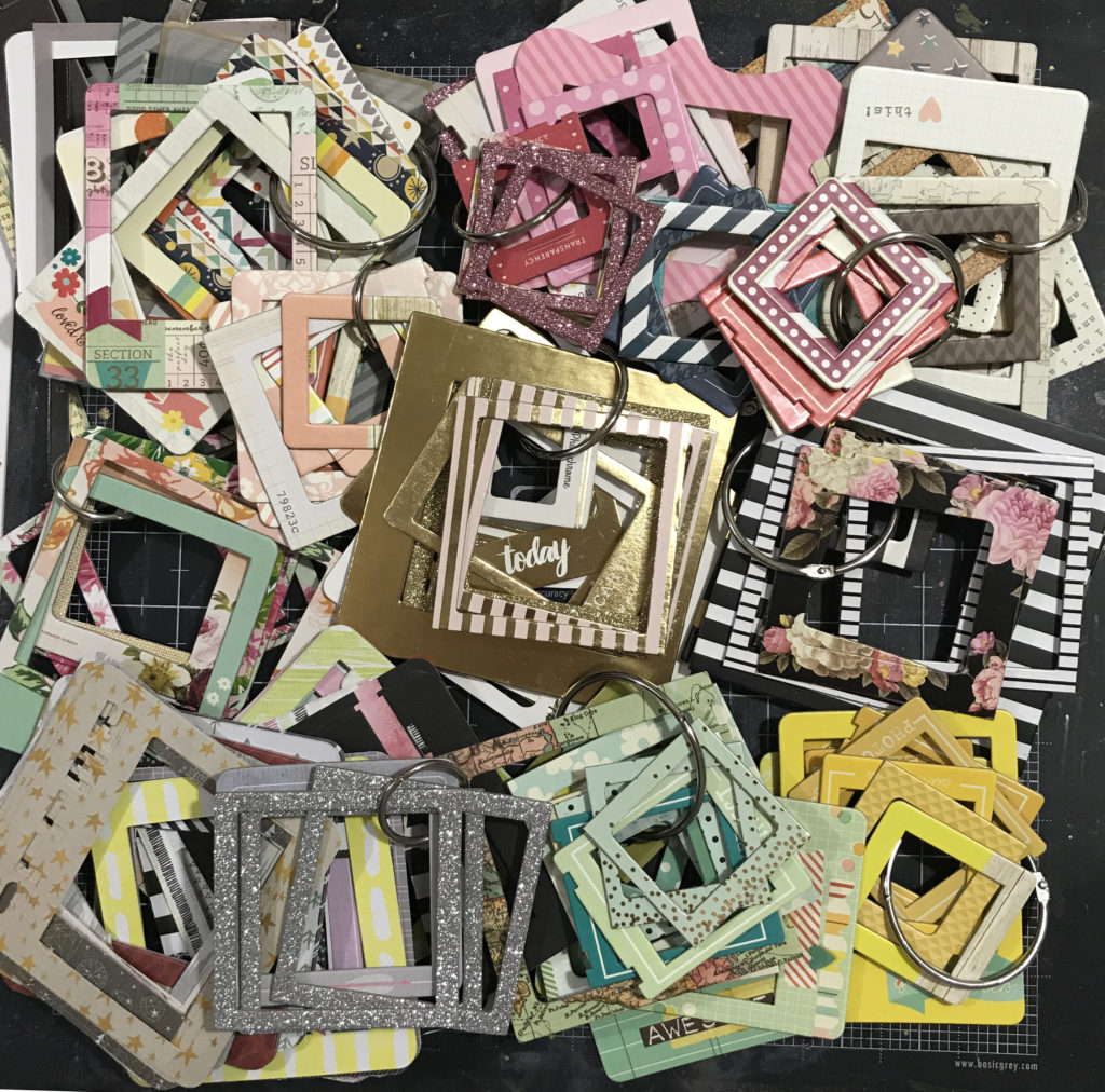 Brilliant way to organize frame embellishments for scrapbooking! The post has gorgeous sample layouts too!
